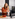 Woman talking on the phone while cooking