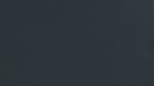 Eine Nahaufnahme eines dunkelblauen Stoffes mit einer leicht strukturierten Oberfläche, möglicherweise für Polster oder Vorhänge verwendet.