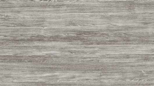 Eine Nahaufnahme einer grauen holzähnlichen Textur, möglicherweise ein Laminat- oder Vinylboden.