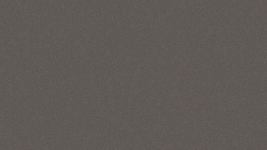 Eine Nahaufnahme einer glatten, grauen Oberfläche mit einer subtilen Textur, möglicherweise eine Stoff- oder Materialprobe.