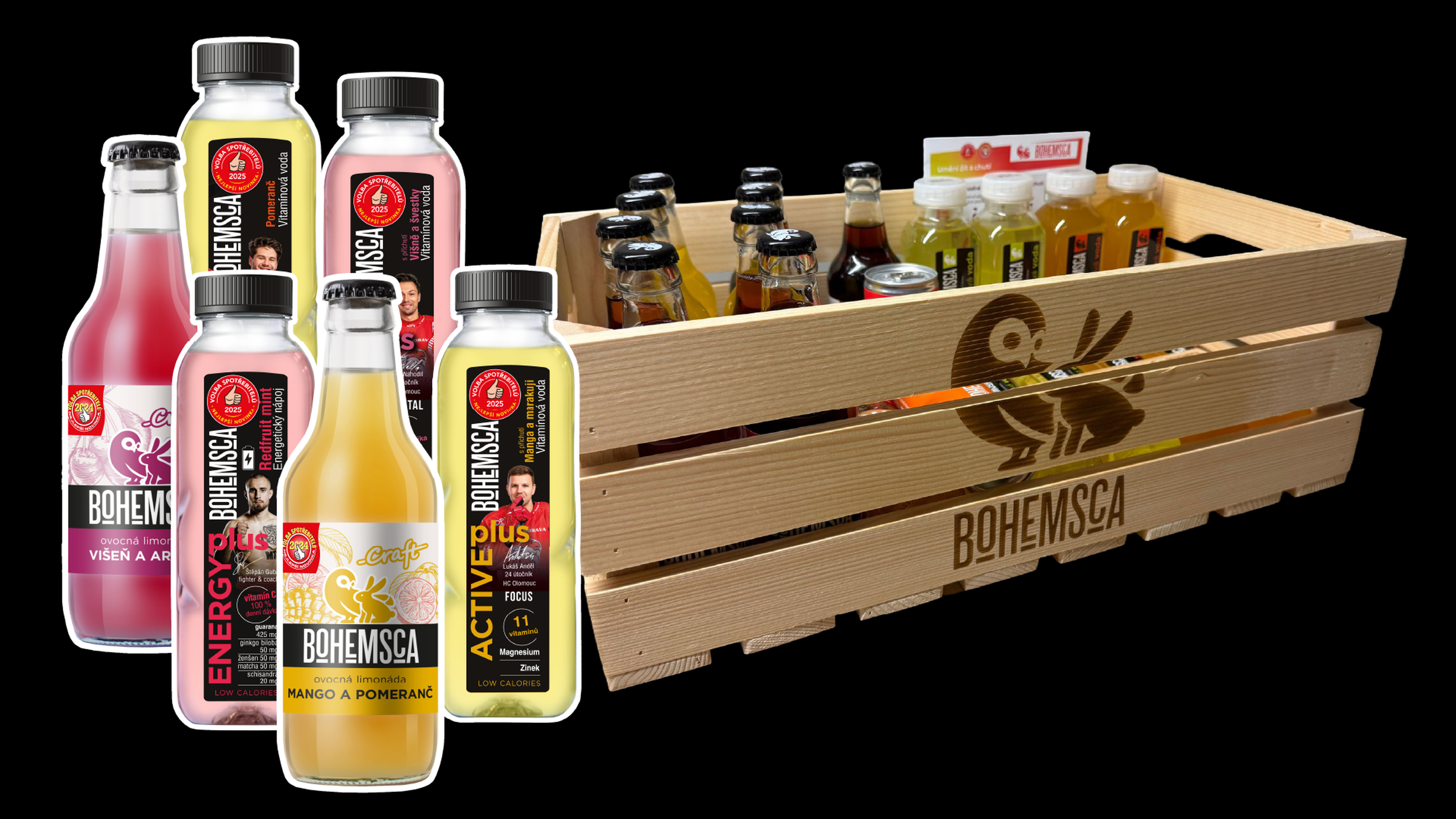 Dřevěná bedna naplněná nejrůznějšími nápoji Bohemsca, včetně lahví s příchutí mango-pomeranč a granátové jablko.