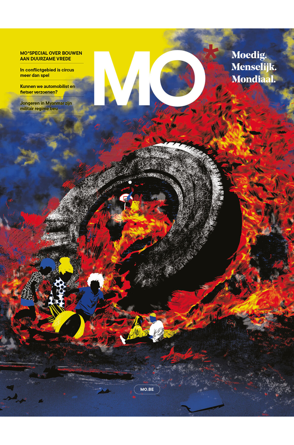 Magazine cover with bold "MO" title, showing vibrant colors and abstract imagery of fire and a large tire. Text in Dutch on the left side.