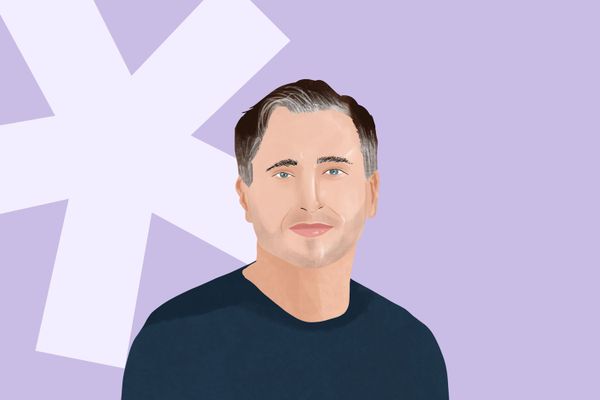 Illustration of a man with short dark hair and blue eyes against a light purple background with white geometric shapes.