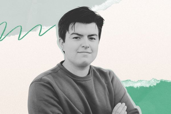 A person with short dark hair wearing a sweatshirt, standing against an abstract background with green and white elements.