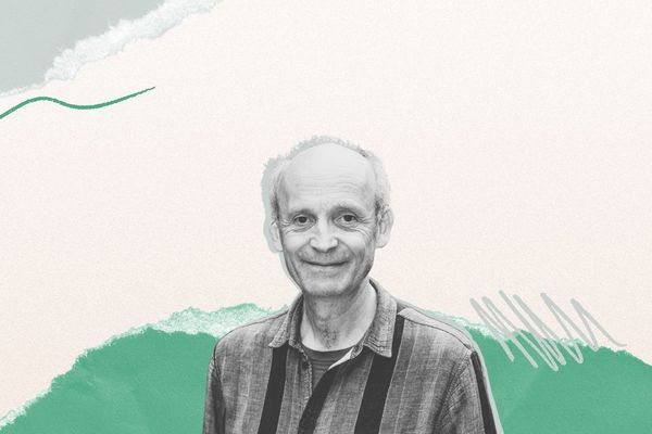 Smiling man with a receding hairline against an abstract background of torn paper textures and green scribbles.
