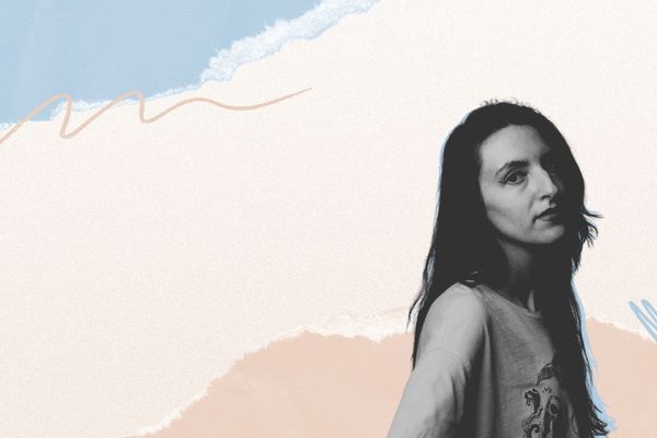 Monochrome portrait of a woman in front of an abstract pastel background with blue and beige swirls.