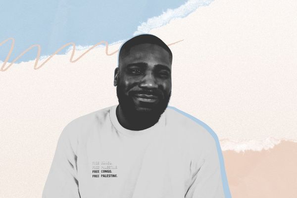 Smiling bearded man in a white T-shirt reading "FREE CONGO. FREE PALESTINE." on a textured pastel torn-paper background.