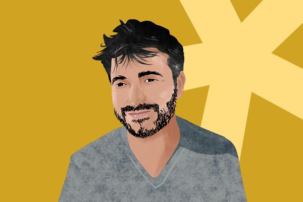 Illustration of a man with dark hair and a beard, smiling, on a yellow background with a large light yellow star shape.