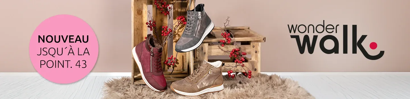 Drei knöchelhohe Sneaker in Bordeauxrot, Grau und Beige auf und vor Holzkisten mit roten Beerenzweigen, daneben ein runder Hinweis „Neu jetzt bis Größe 43“.
