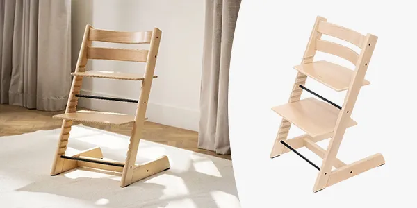 Verstellbarer Hochstuhl aus Holz mit natürlicher Oberfläche und minimalistischem Design, präsentiert auf einem hellen Teppich vor weißem Hintergrund.