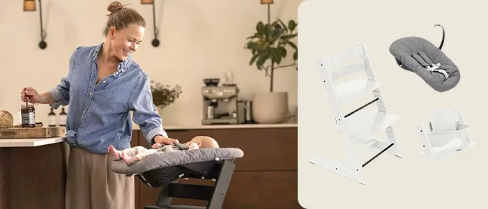 Eine Frau lächelt ein Baby im Hochstuhl an. Daneben ist vor beigem Hintergrund ein Hochstuhl mit Zubehör zu sehen.