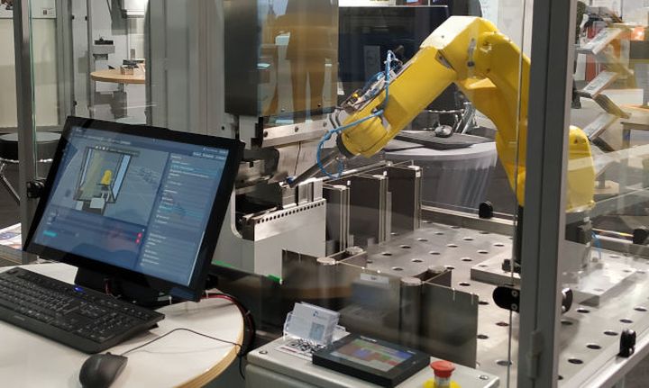 Simulation with yellow robot arm and user screen, software interface