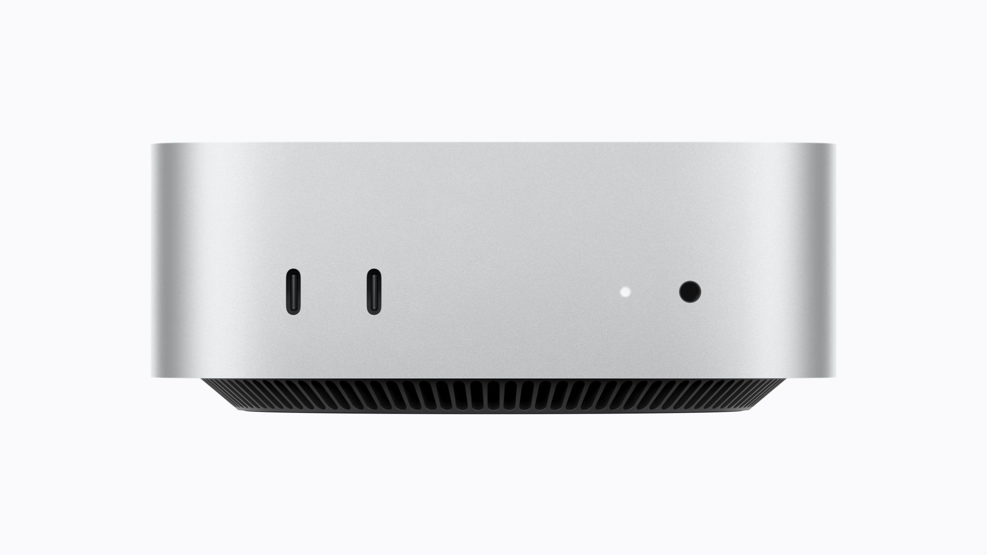 Apple Mac mini with USB-C ports and a power indicator light on the front.