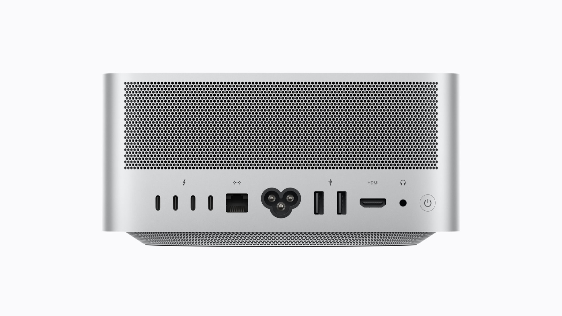 Back view of a silver Mac Studio computer showing various ports, including USB, HDMI, and power, with a perforated vent design.