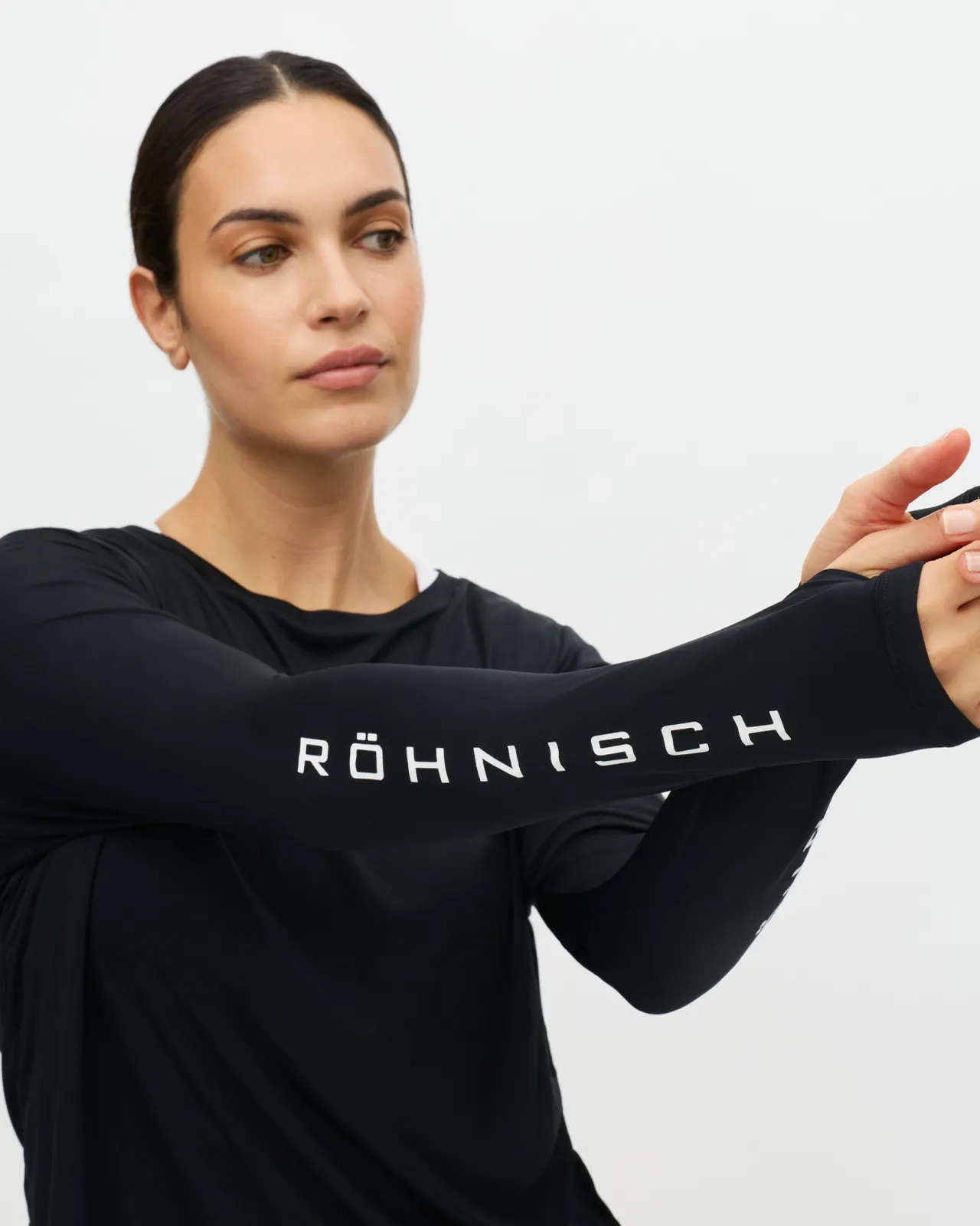 Woman in black shirt with white text Röhnisch