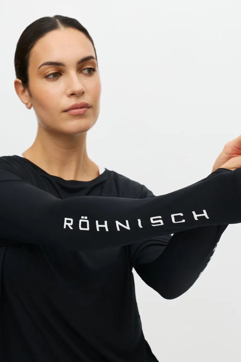 Woman in black shirt with white text Röhnisch