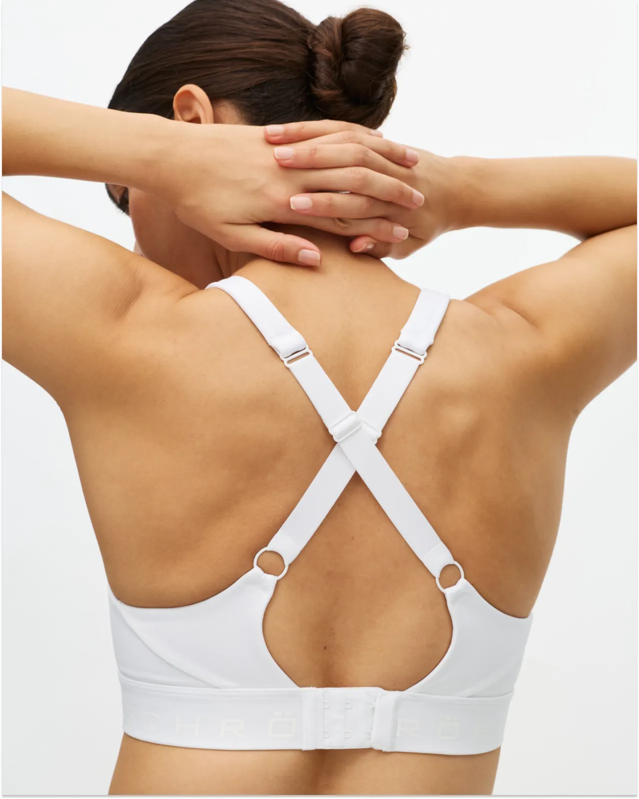 A woman's back showing the back of a sports bra