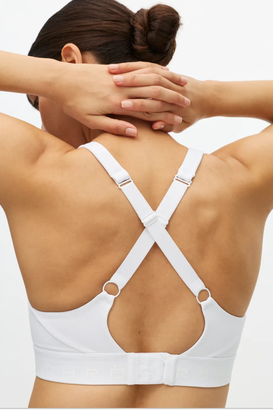 A woman's back showing the back of a sports bra
