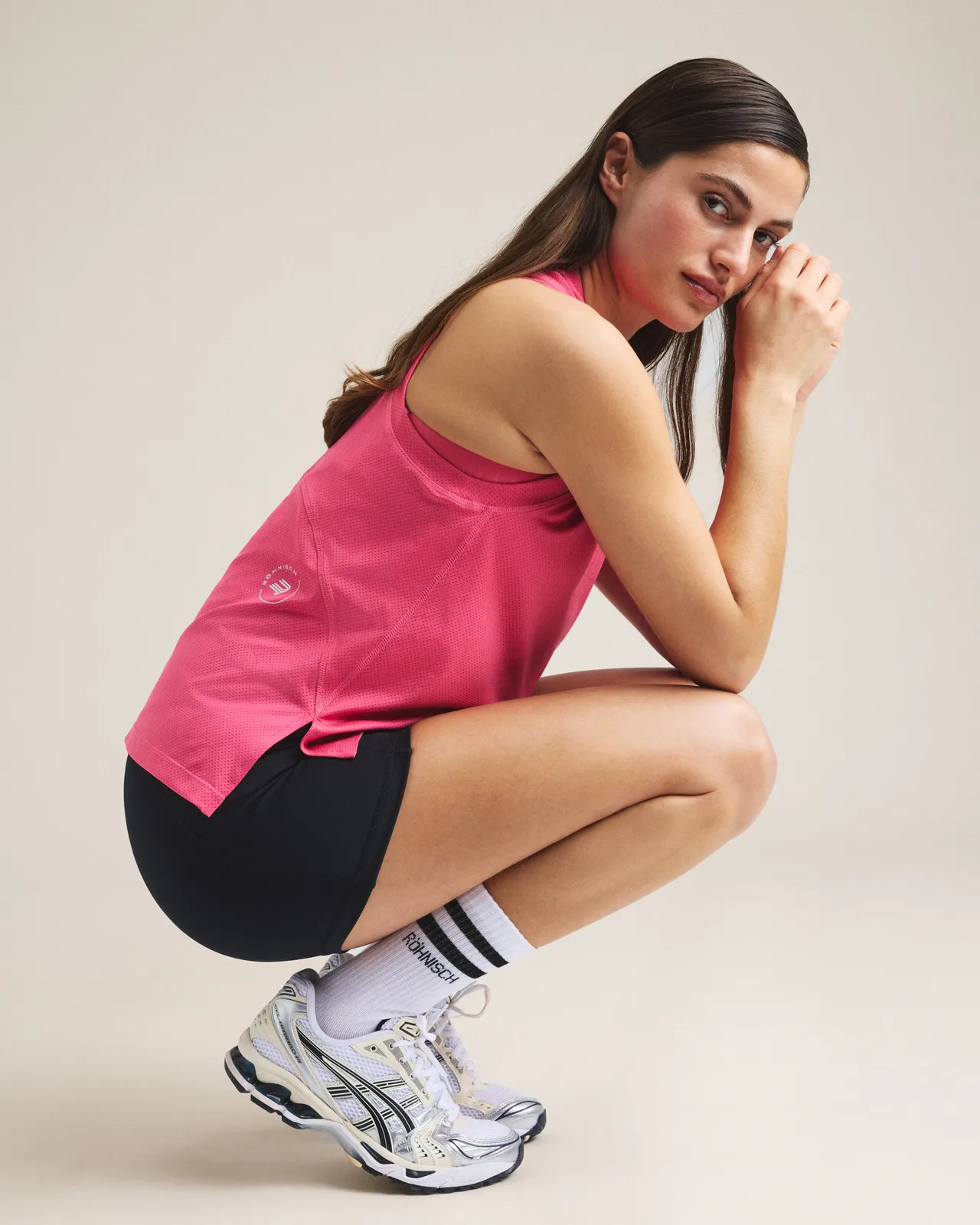 Woman in pink top and black bike tights