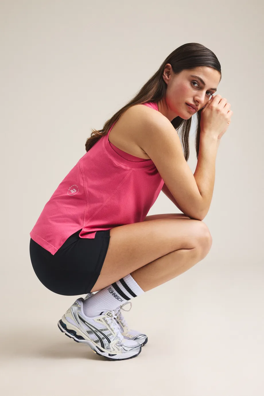 Woman in pink top and black bike tights