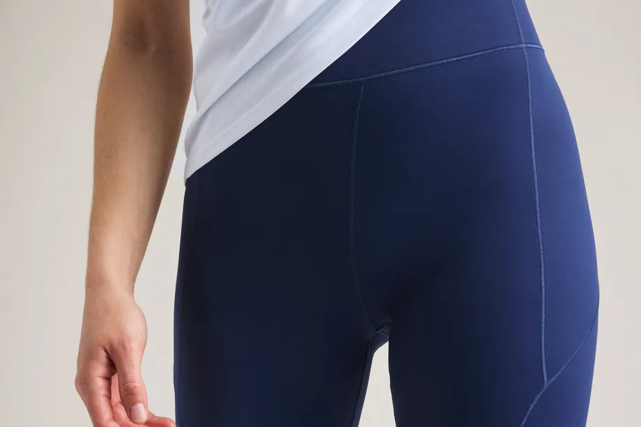 Woman in blue bike tights and white t-shirt