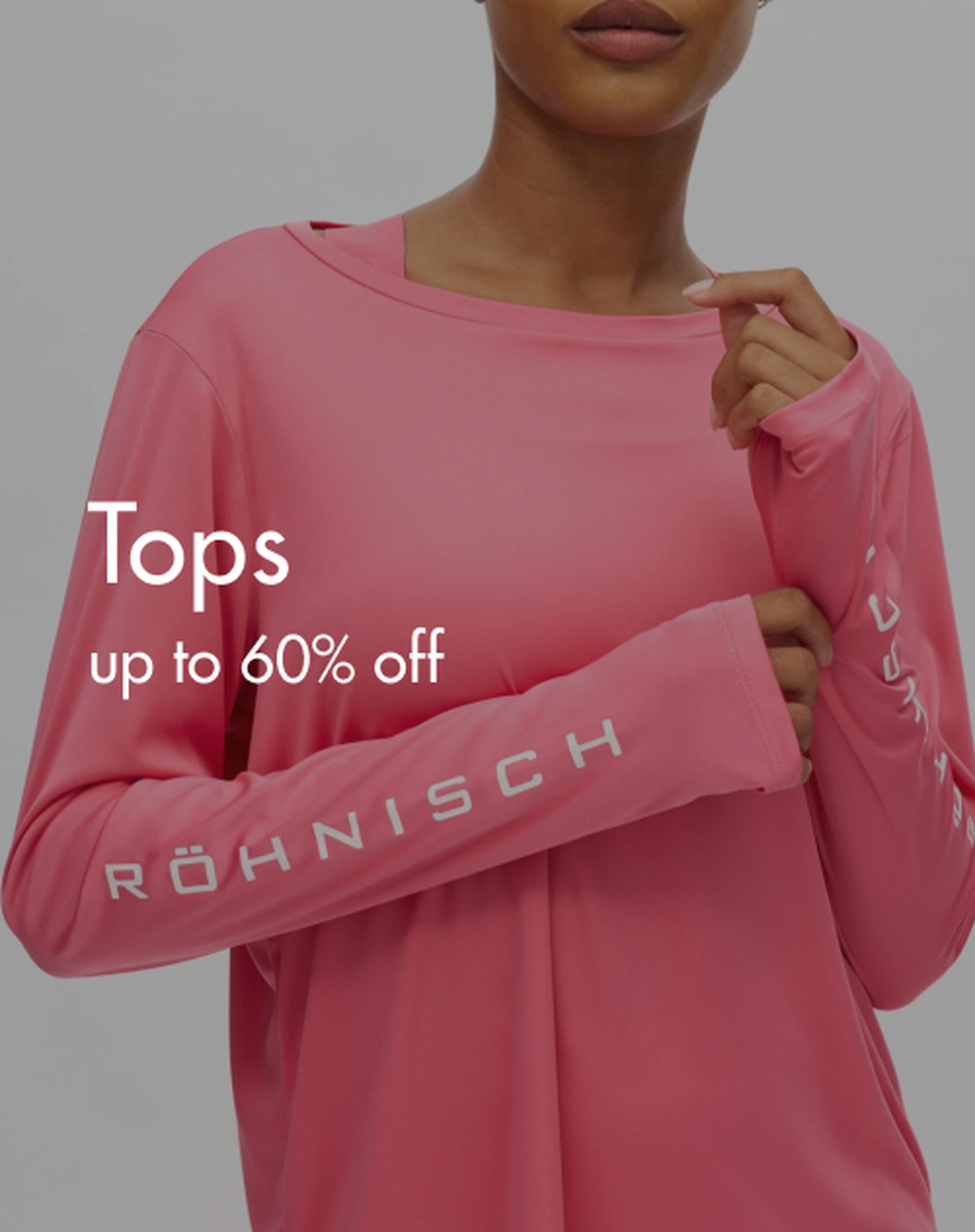 Person wearing a pink Röhnisch long-sleeve shirt, shown from shoulders down, with text: "Tops up to 60% off."