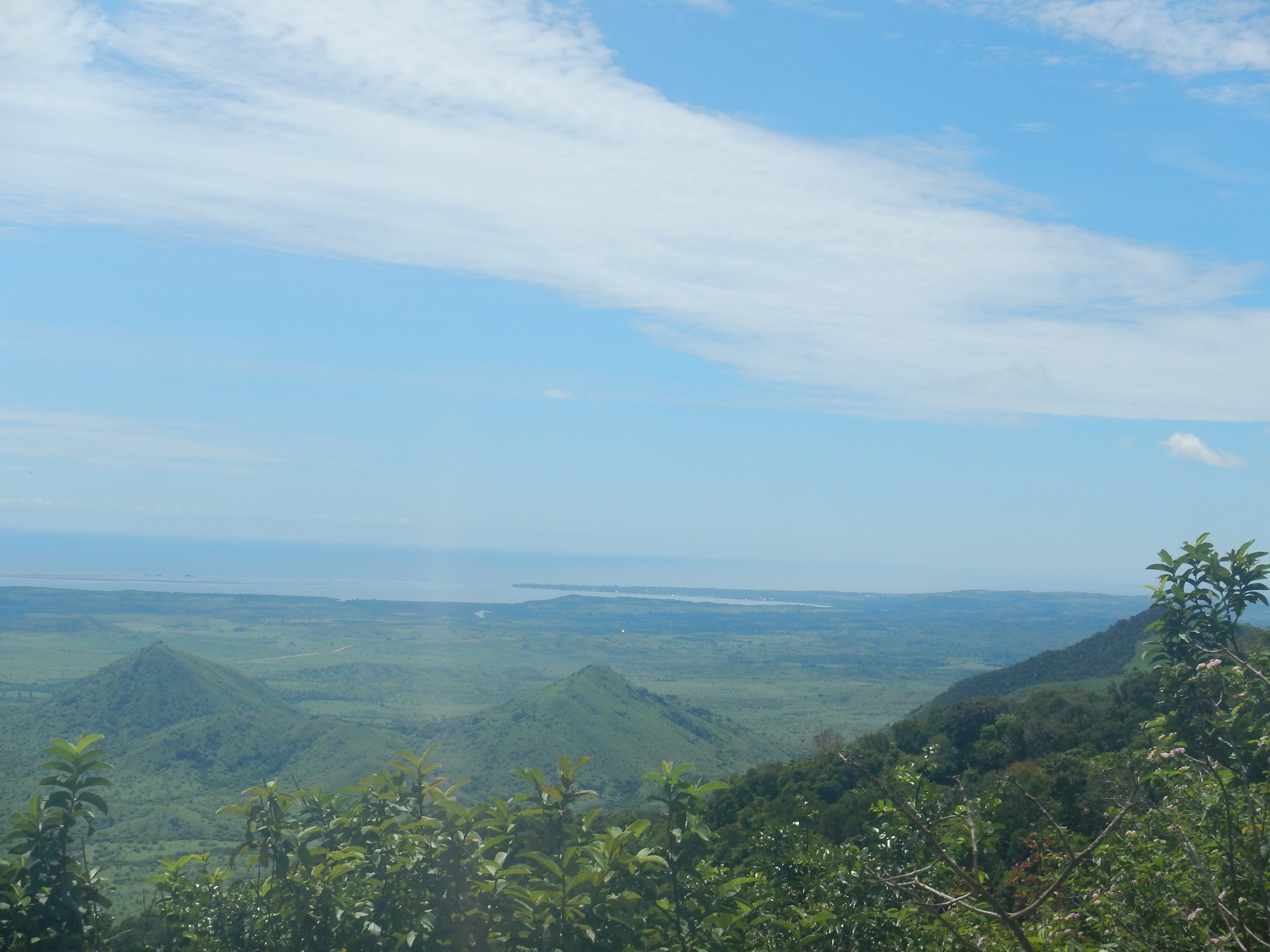 Landscape in Madagascar, green trees, hills and the sea in the distance