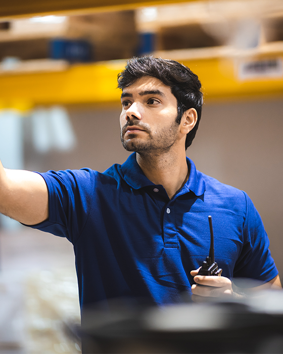 Warehouse worker wearing Alsico’s branded polo shirt.