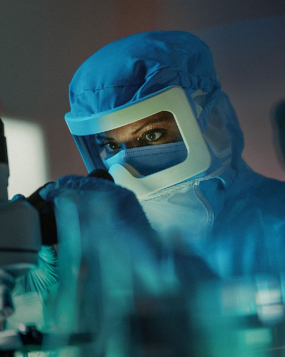 Laboratory technician wearing Alsico labwear for cleanroom and scientific environments.