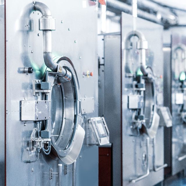 Industrial laundry machines for professional workwear and PPE cleaning at Alsico.