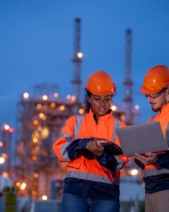 Gas plant industrial site workers wearing Alsico’s high-spec PPE garments.