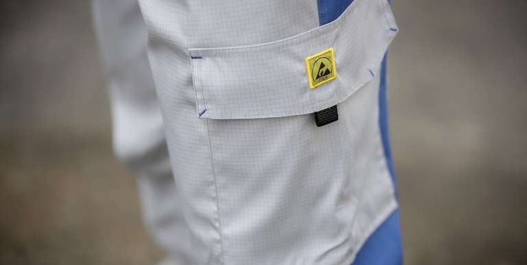 Worker in ESD protective clothing for Alsico's cleanroom line.