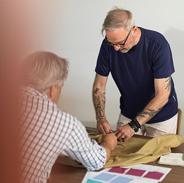 Designer sketching new clothing patterns for Alsico’s custom workwear range.