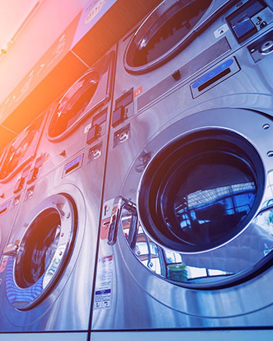 Industrial laundry washing Alsico’s reusable healthcare and cleanroom uniforms.