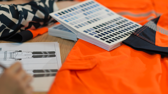 Team meeting displaying Alsico’s expertise in mastering workwear solutions.