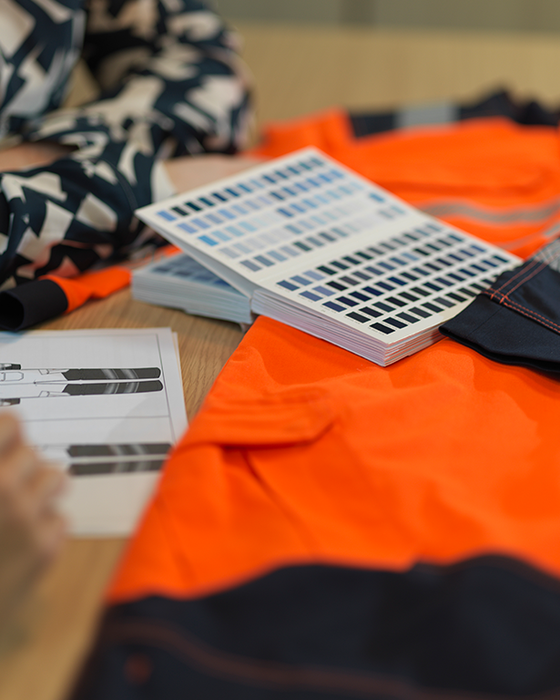 Team meeting displaying Alsico’s expertise in mastering workwear solutions.