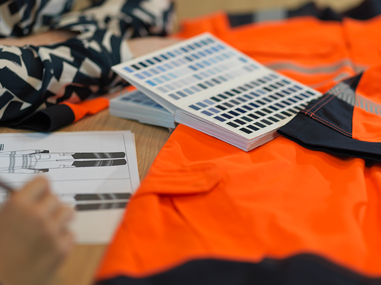 Team meeting displaying Alsico’s expertise in mastering workwear solutions.