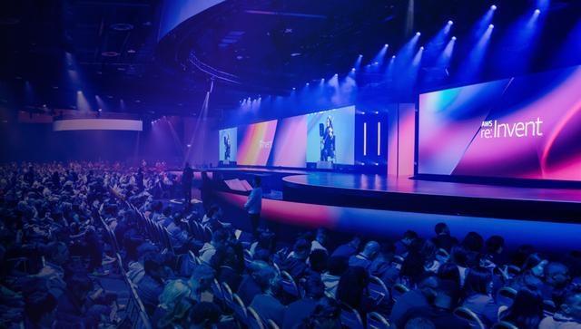 A bright blue image from AWS re:invent event, with Apply Digital's logo