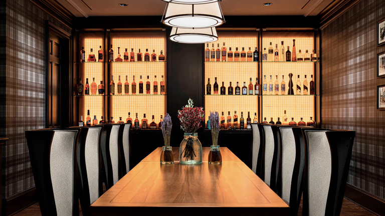 An image of the private dinning room, The Distillery, from the AG, Modern Bar and Steakhouse at The Ritz Carlton