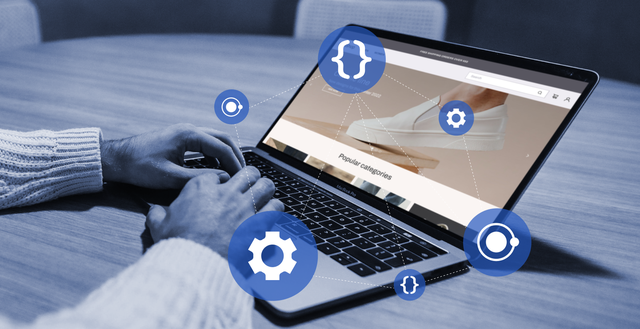 Hands typing on a laptop surrounded by floating icons