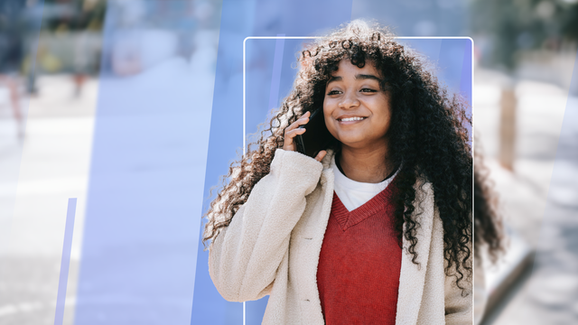 Woman speaking on her cell phone as she walks down the street