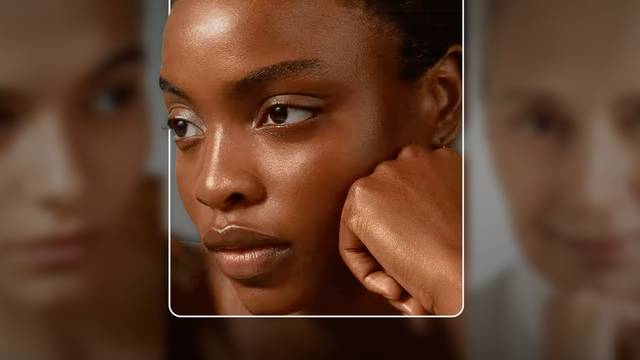 woman resting her face on her closed fist looking sideways