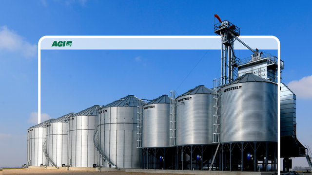 An abstract desktop with AGI's logo is displayed over grain siloes.