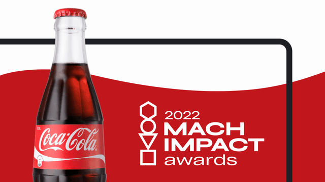 A glass bottle of Coca Cola appearing in front of a red and white swoosh