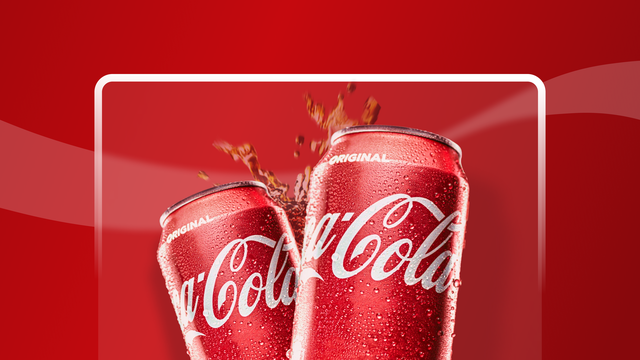 Two coca-cola cans "cheers" each other, with drink splashing up behind them.