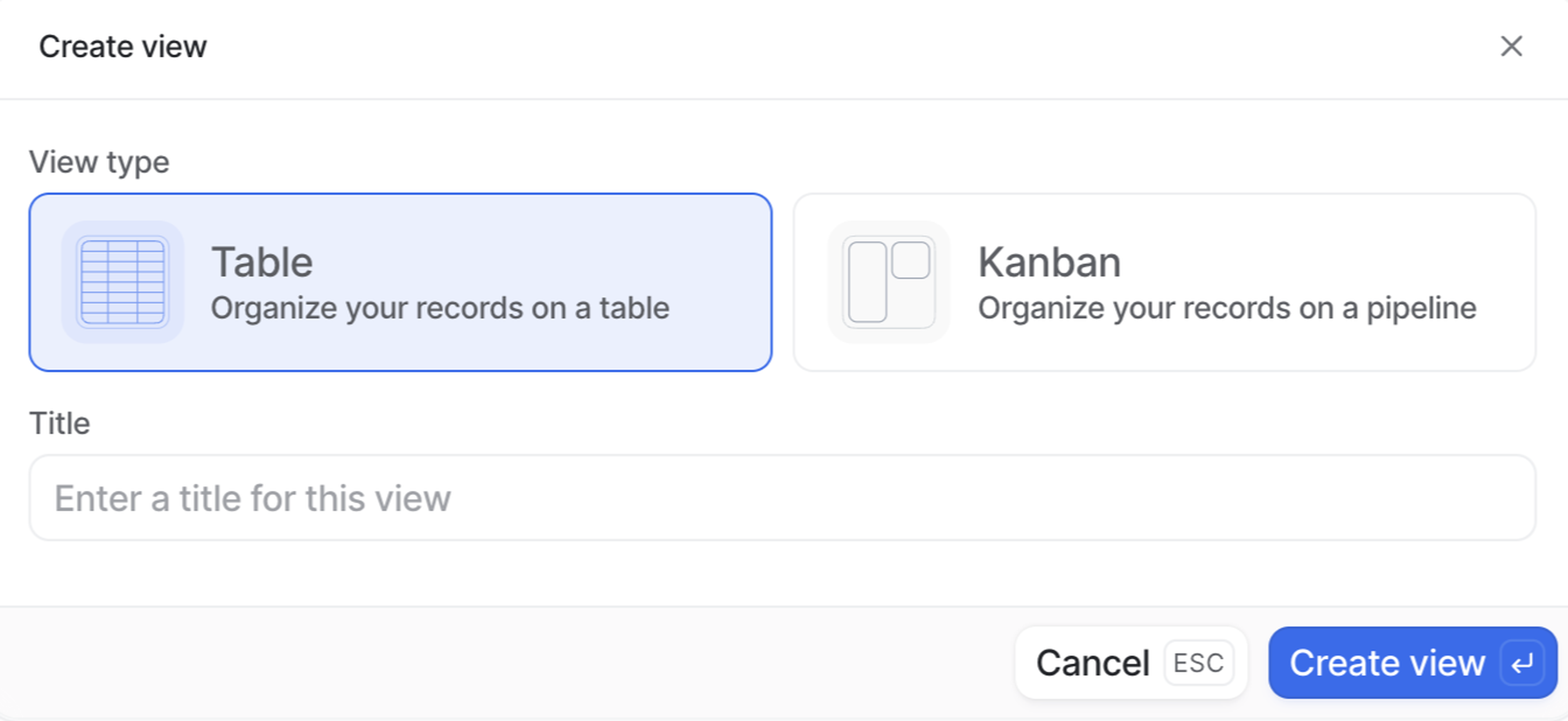 Dialog box for creating a view, with options for "Table" and "Kanban," a title input field, and "Create view" and "Cancel" buttons.
