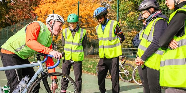 Instructor delivering adult cycle training