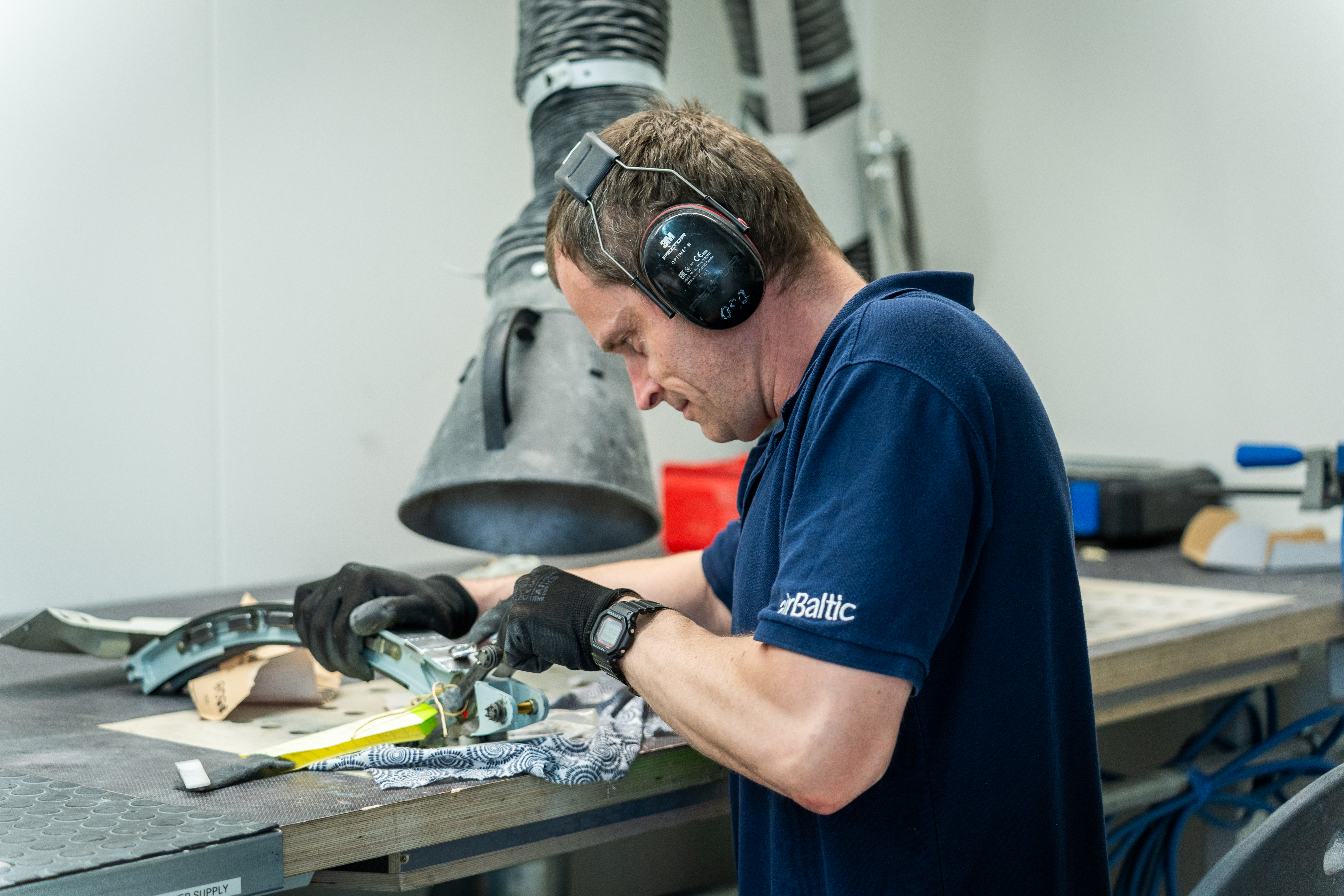 Technician restoring the slat track surface