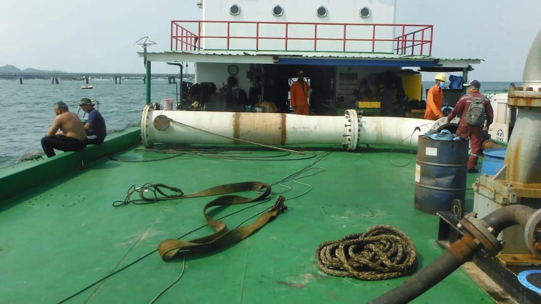 DEXON pipeline engineers preparing subsea launcher for installation at PLEM below SBM