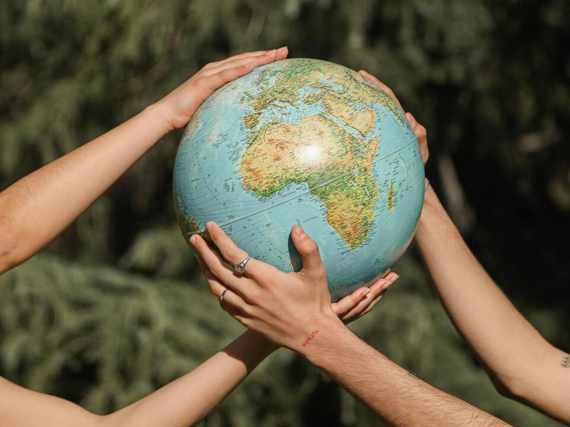 People Holding a Globe CC